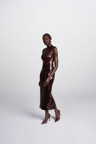Dahlia wine sleeveless mock neck sequin midi dress front view
 back view showing back slit 
side profile walking 
 detail shot square cut sequin close up
lifestyle shot Australian luxury eveningwear