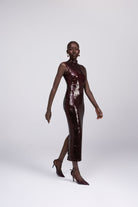Dahlia wine sleeveless mock neck sequin midi dress front view
 back view showing back slit 
side profile walking 
 detail shot square cut sequin close up
lifestyle shot Australian luxury eveningwear