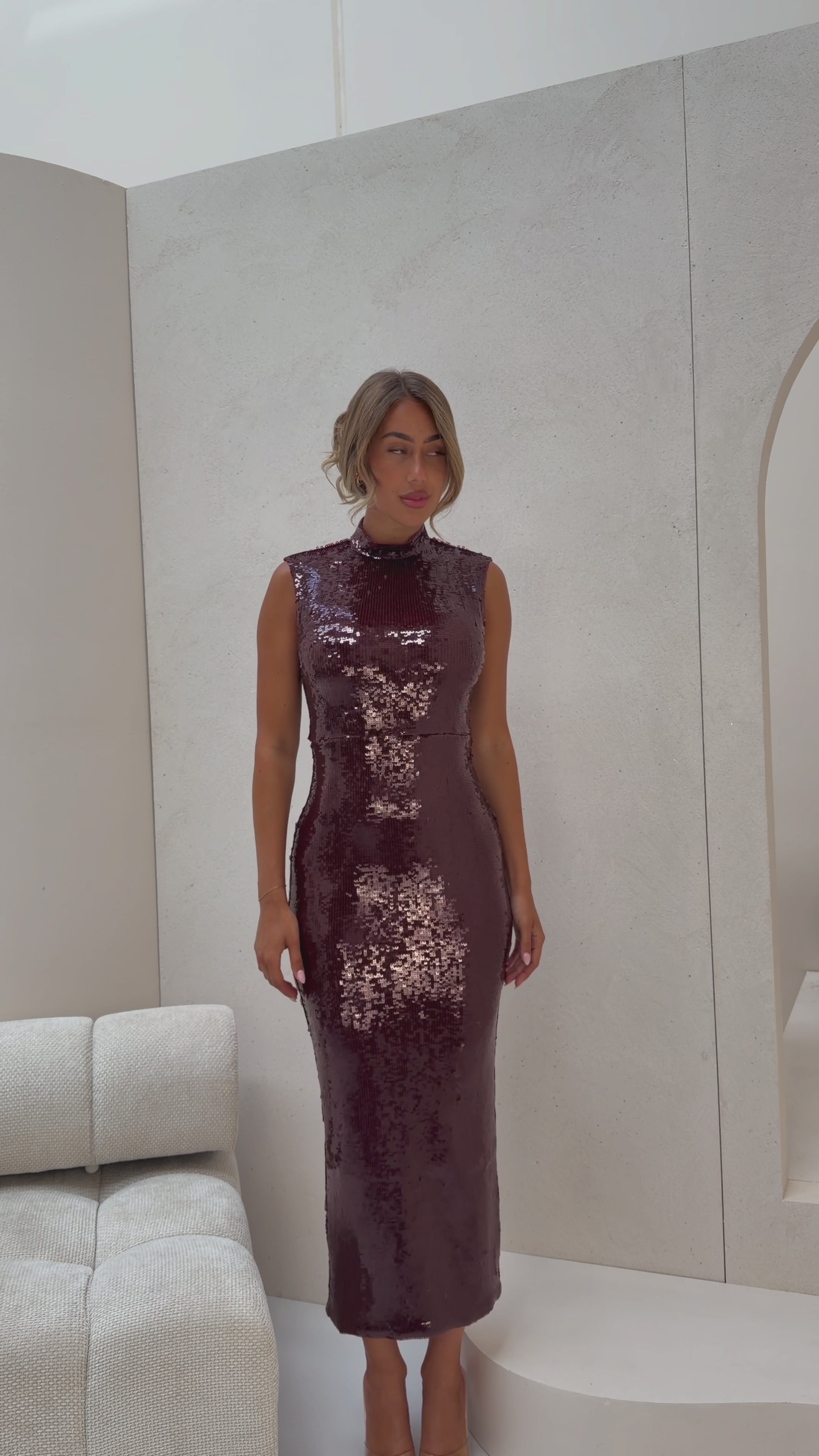 Dahlia wine sleeveless mock neck sequin midi dress front view
 back view showing back slit 
side profile walking 
 detail shot square cut sequin close up
lifestyle shot Australian luxury eveningwear
